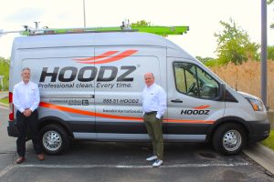grand rapids team in front of hoodz truck