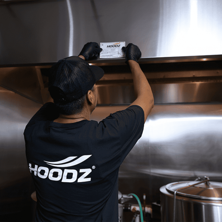 hoodz techs in a clean kitchen