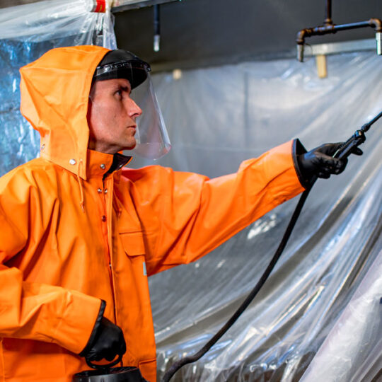 HOODZ service tech cleaning kitchen hood