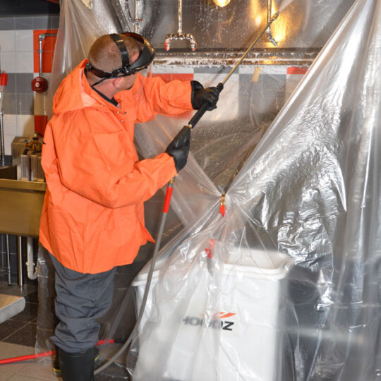 HOODZ Technician performing commercial kitchen cleaning