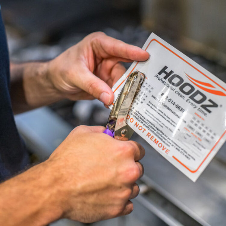 HOODZ leaves a service tag to keep track of regular cleanings