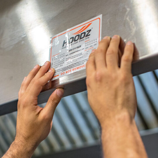 HOODZ leaves a service tag to help keep track of when your hood's last cleaning was
