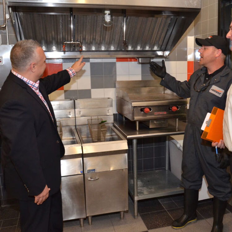 HOODZ inspecting a dirty kitchen exhaust hood