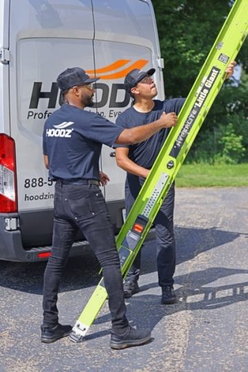 hoodz techs climbing onto roof