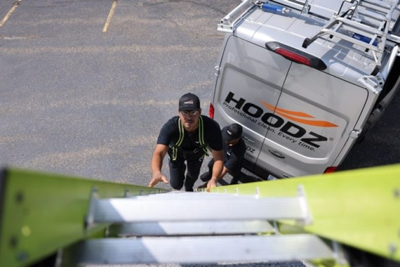 hoodz tech climbing onto a roof