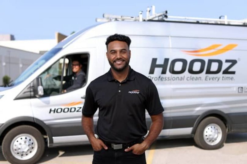 hoodz tech in front of a van