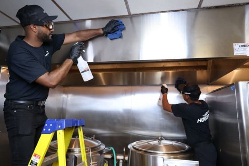 hoodz techs cleaning kitchen